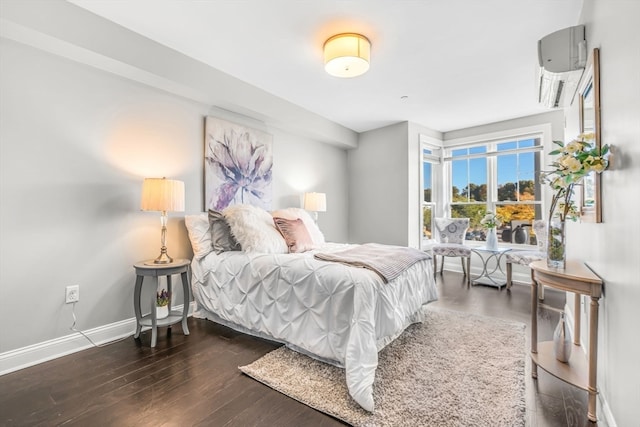 bedroom with dark hardwood / wood-style floors