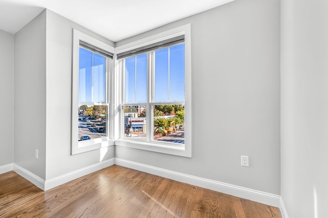 spare room with hardwood / wood-style flooring