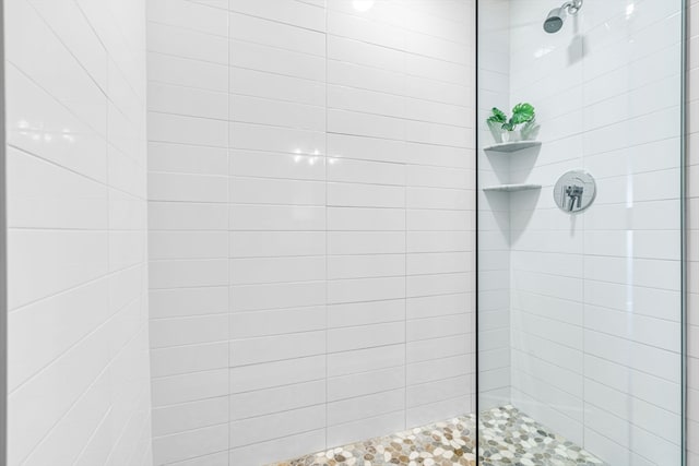 bathroom with a tile shower