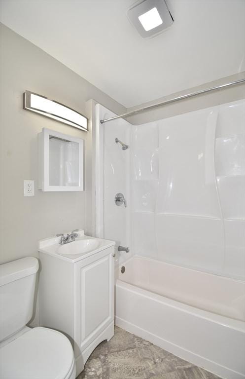 bathroom with toilet, shower / washtub combination, and vanity