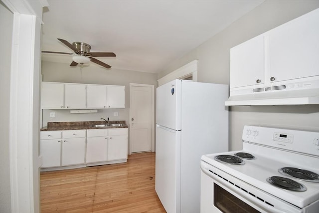 kitchen with white appliances, under cabinet range hood, a sink, white cabinets, and light wood finished floors
