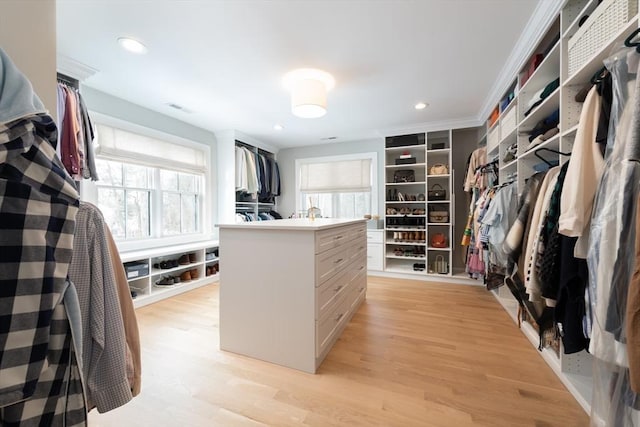 walk in closet with light wood-style floors and visible vents