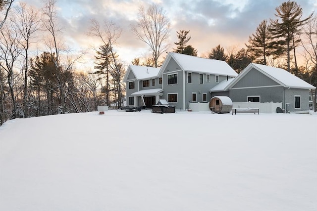 view of snow covered house