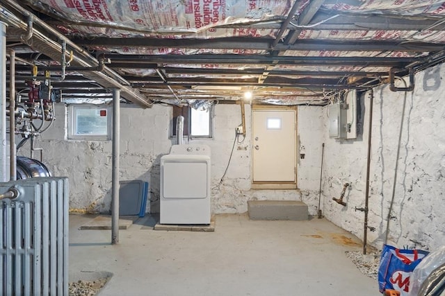 basement with washer / dryer, radiator heating unit, healthy amount of natural light, and electric panel