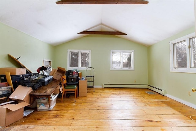 misc room featuring lofted ceiling and light hardwood / wood-style flooring