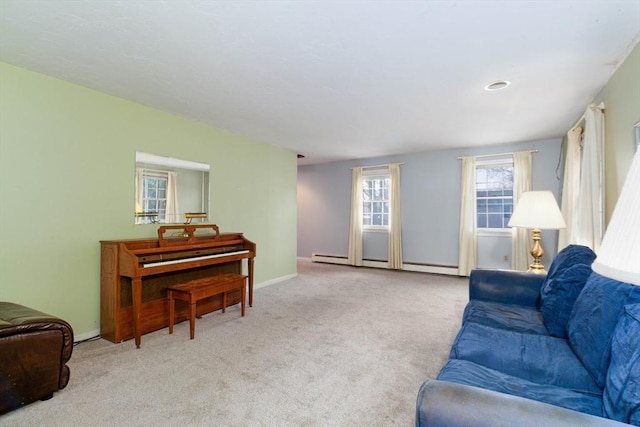 living room with a baseboard radiator and light carpet