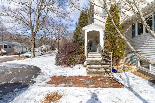 view of snow covered property entrance