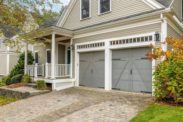 108 Johnson Woods Unit 108, Reading, MA 01867 - garage featuring decorative driveway