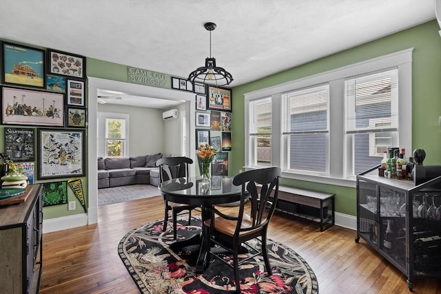 63-65 Brookley Rd Unit 3, Boston, MA 02130 - dining space with wood-type flooring and a wall mounted AC