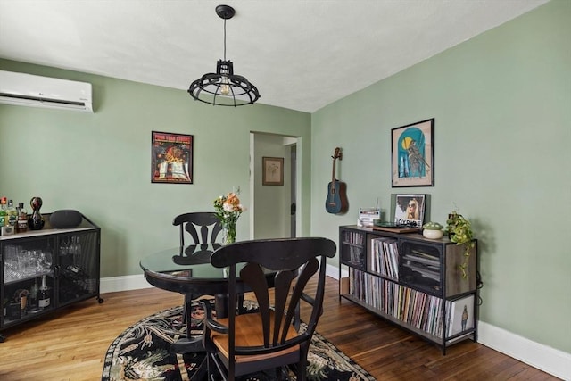 63-65 Brookley Rd Unit 3, Boston, MA 02130 - dining area featuring a wall mounted AC and wood finished floors