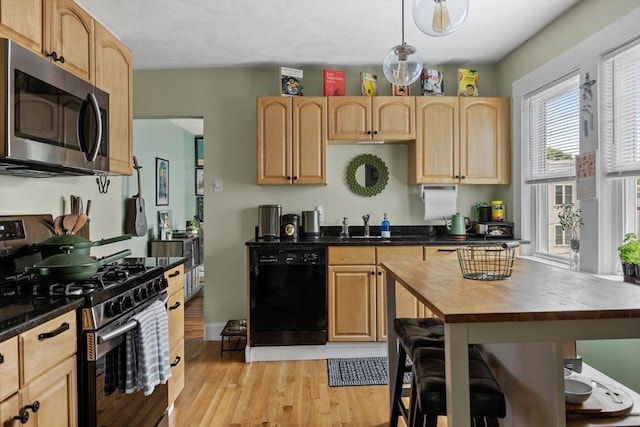 63-65 Brookley Rd Unit 3, Boston, MA 02130 - kitchen with appliances with stainless steel finishes, light wood-style floors, butcher block countertops, and light brown cabinetry