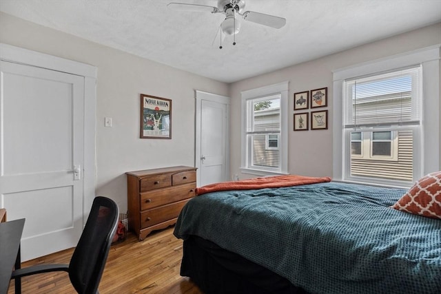 63-65 Brookley Rd Unit 3, Boston, MA 02130 - bedroom with light wood finished floors, a ceiling fan, and a desk