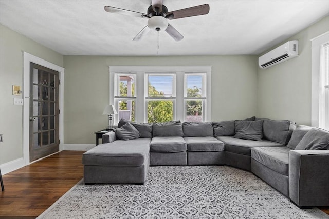 63-65 Brookley Rd Unit 3, Boston, MA 02130 - living room with a wall mounted air conditioner, wood finished floors, and a ceiling fan