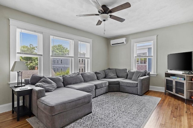 63-65 Brookley Rd Unit 3, Boston, MA 02130 - living room with a wall mounted AC, hardwood / wood-style flooring, and a ceiling fan