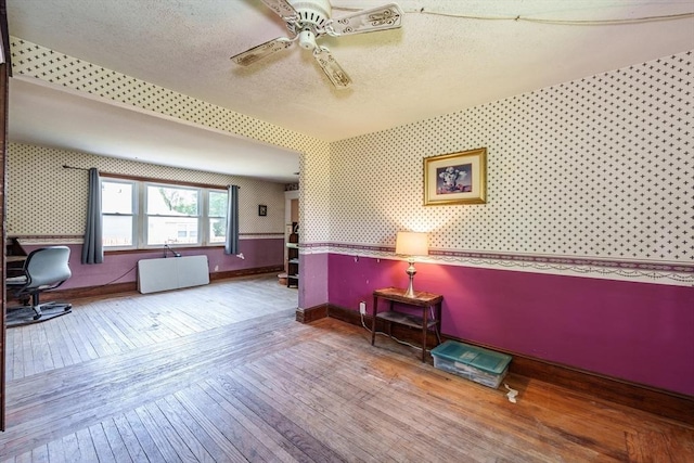 164 Leonard St, Agawam, MA 01001 - living area featuring wallpapered walls, wood-type flooring, ceiling fan, baseboards, and a textured ceiling