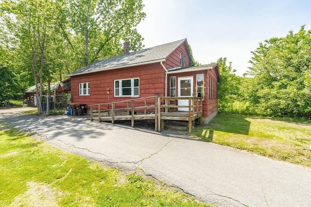 164 Leonard St, Agawam, MA 01001 - view of front of home with a chimney, a front lawn, a deck, and a shingled roof