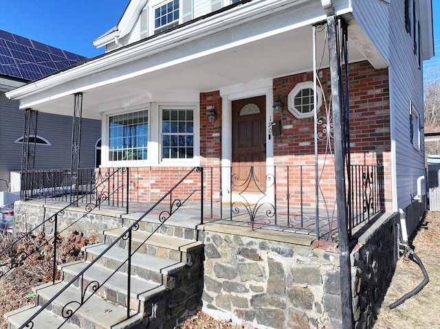 doorway to property with covered porch