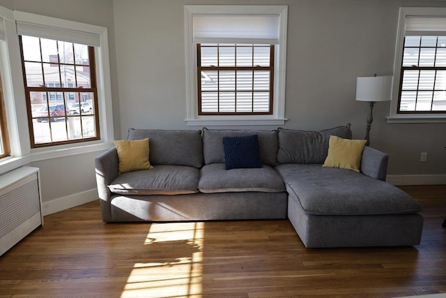 living room featuring radiator and dark hardwood / wood-style floors