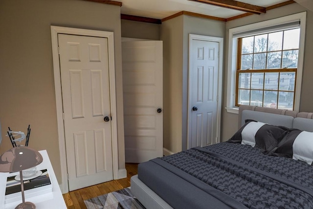 bedroom with hardwood / wood-style floors