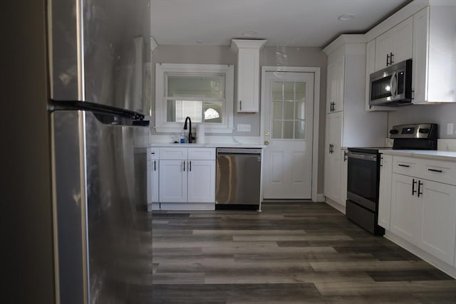 kitchen featuring white cabinetry, appliances with stainless steel finishes, and sink