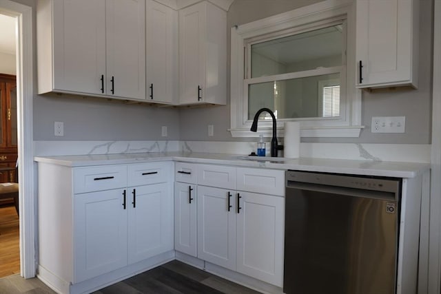 kitchen featuring white cabinetry, sink, and stainless steel dishwasher