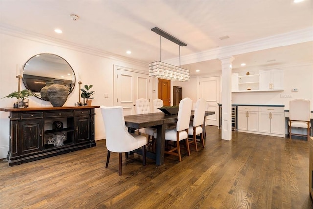 dining area with recessed lighting, decorative columns, dark wood-type flooring, and crown molding