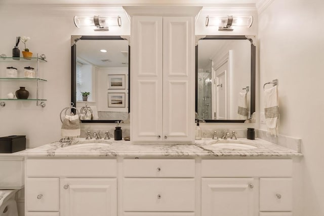 bathroom featuring a sink, double vanity, and crown molding