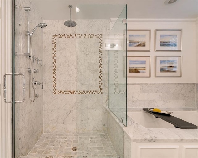 bathroom with ornamental molding and a shower stall