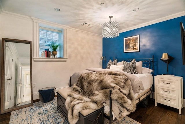 bedroom featuring visible vents, a notable chandelier, ornamental molding, baseboards, and dark wood-style flooring