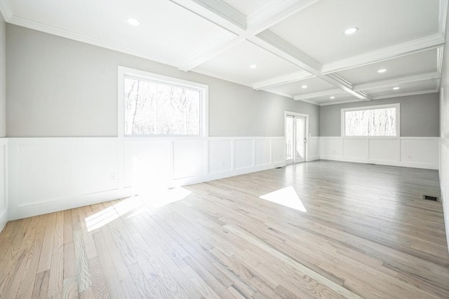 1 Falcon Dr, Shrewsbury, MA 01545 - empty room featuring coffered ceiling, a decorative wall, beamed ceiling, and wood finished floors