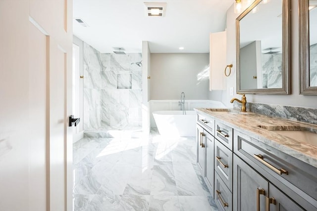 1 Falcon Dr, Shrewsbury, MA 01545 - full bath with marble tiled floors, a marble finish shower, a soaking tub, and double vanity