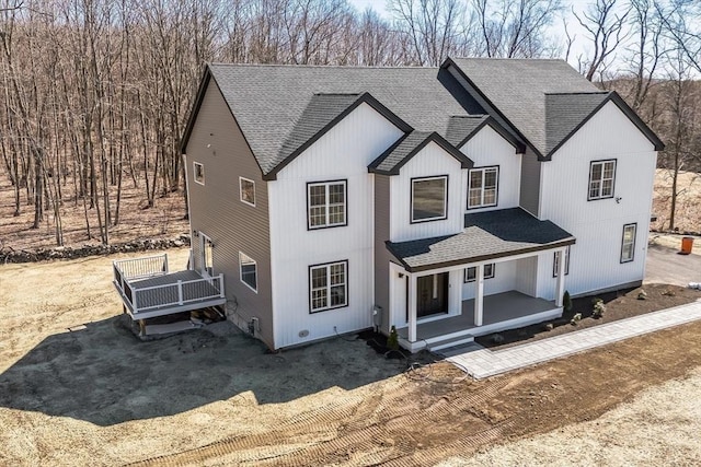 1 Falcon Dr, Shrewsbury, MA 01545 - modern farmhouse style home with a shingled roof and a porch