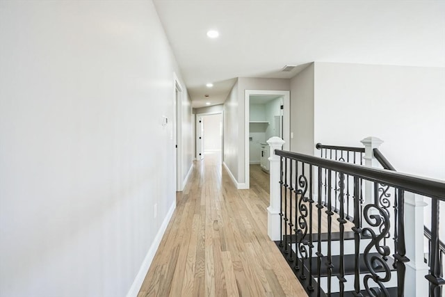 1 Falcon Dr, Shrewsbury, MA 01545 - corridor with an upstairs landing, light wood-style floors, and recessed lighting