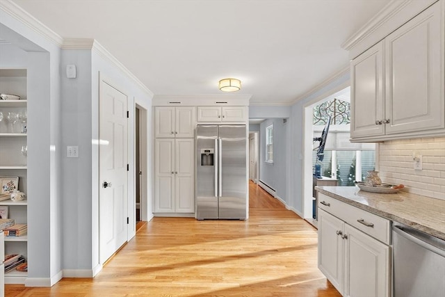 kitchen featuring white cabinetry, light hardwood / wood-style flooring, and appliances with stainless steel finishes