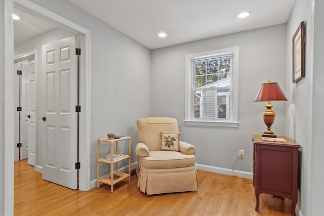 sitting room featuring hardwood / wood-style flooring