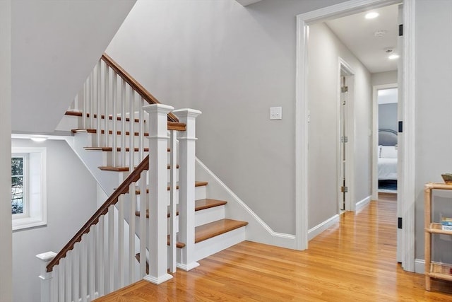 staircase featuring hardwood / wood-style flooring