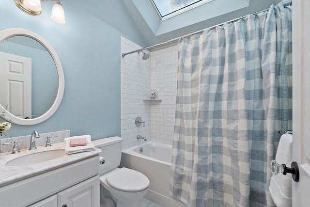 full bathroom with lofted ceiling, vanity, toilet, and shower / bath combo with shower curtain