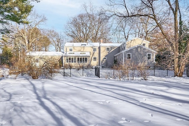 view of snow covered house