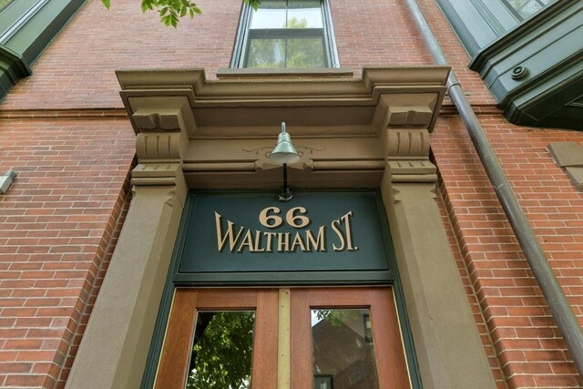 exterior space with brick siding