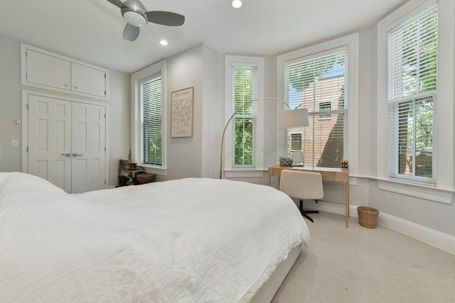 bedroom with carpet floors, baseboards, multiple windows, and recessed lighting