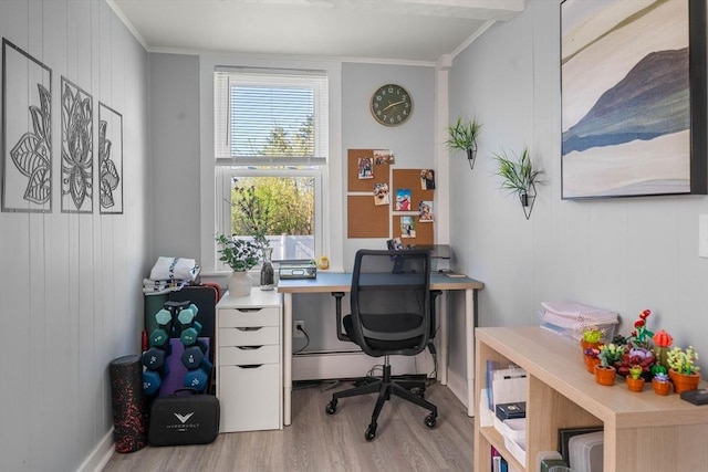 home office featuring crown molding and wood finished floors