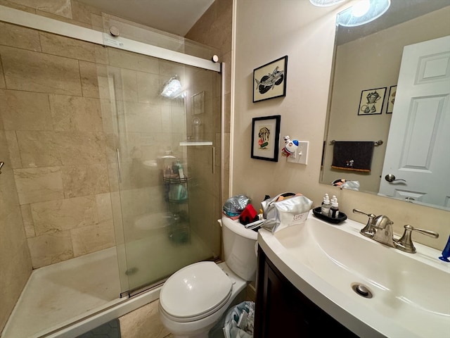 bathroom with vanity, toilet, and walk in shower