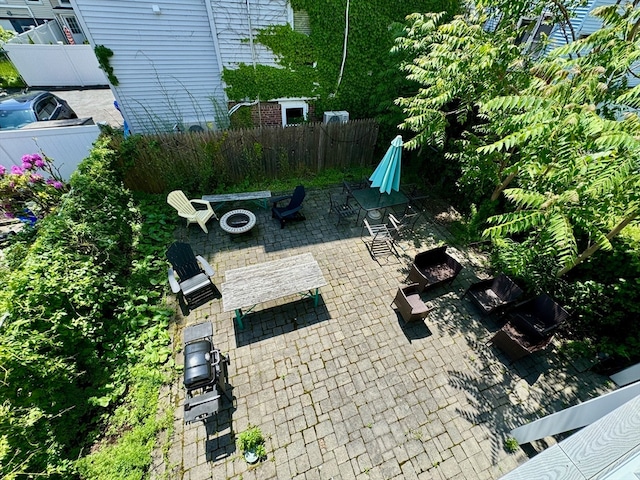 view of patio / terrace with an outdoor fire pit