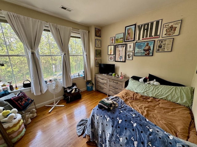 bedroom with wood-type flooring