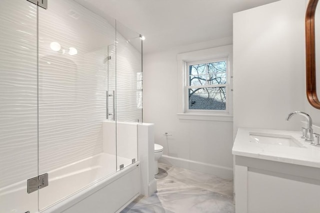 full bathroom with marble finish floor, baseboards, vanity, and toilet