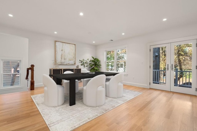 dining area with light wood-type flooring, french doors, baseboards, and recessed lighting