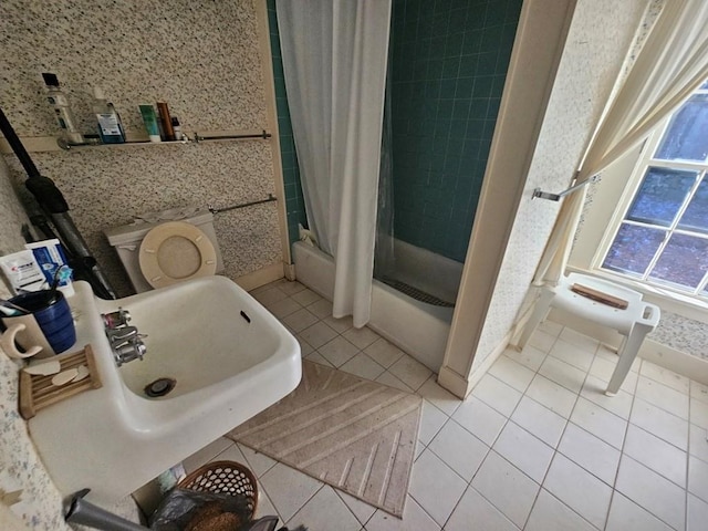 full bathroom with toilet, sink, shower / tub combo with curtain, and tile patterned flooring