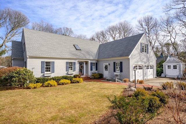 cape cod home with a front yard