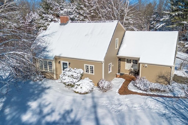 view of snow covered house