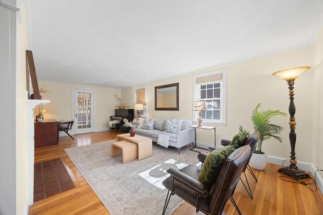 living room featuring baseboards and wood finished floors